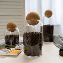 Soft cork lid seated on a clear glass canister